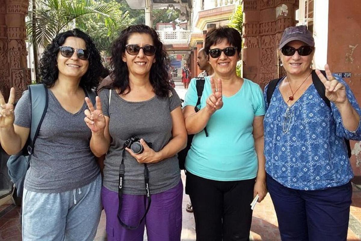 a group of women giving the peace sign