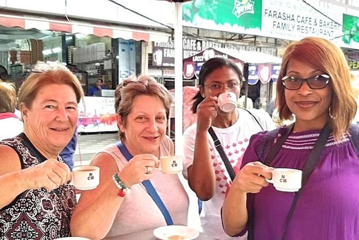 a group of people drinking cups of coffee