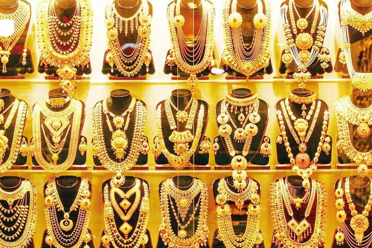a display of gold jewellery on display in a store
