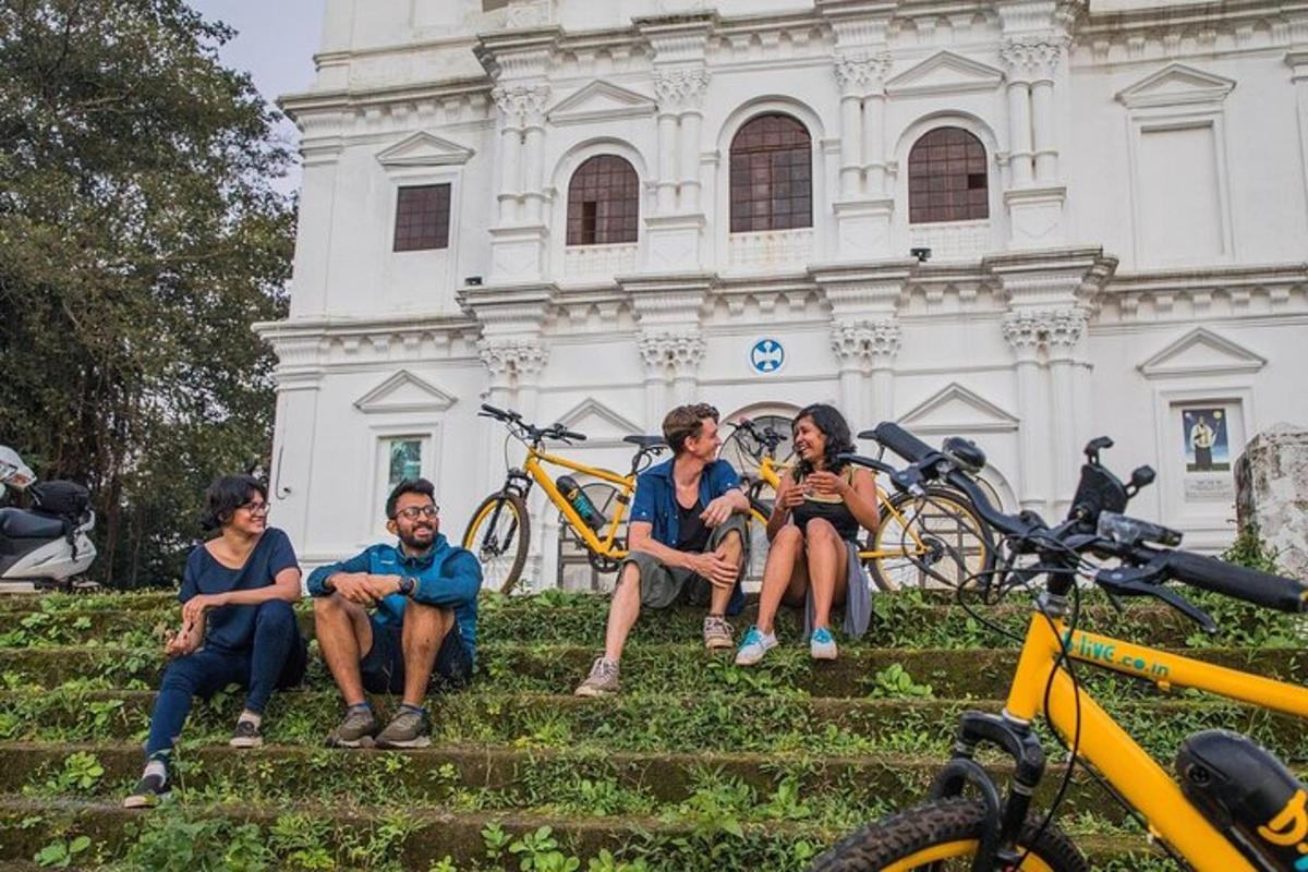 a group of people sitting on steps in front of a building