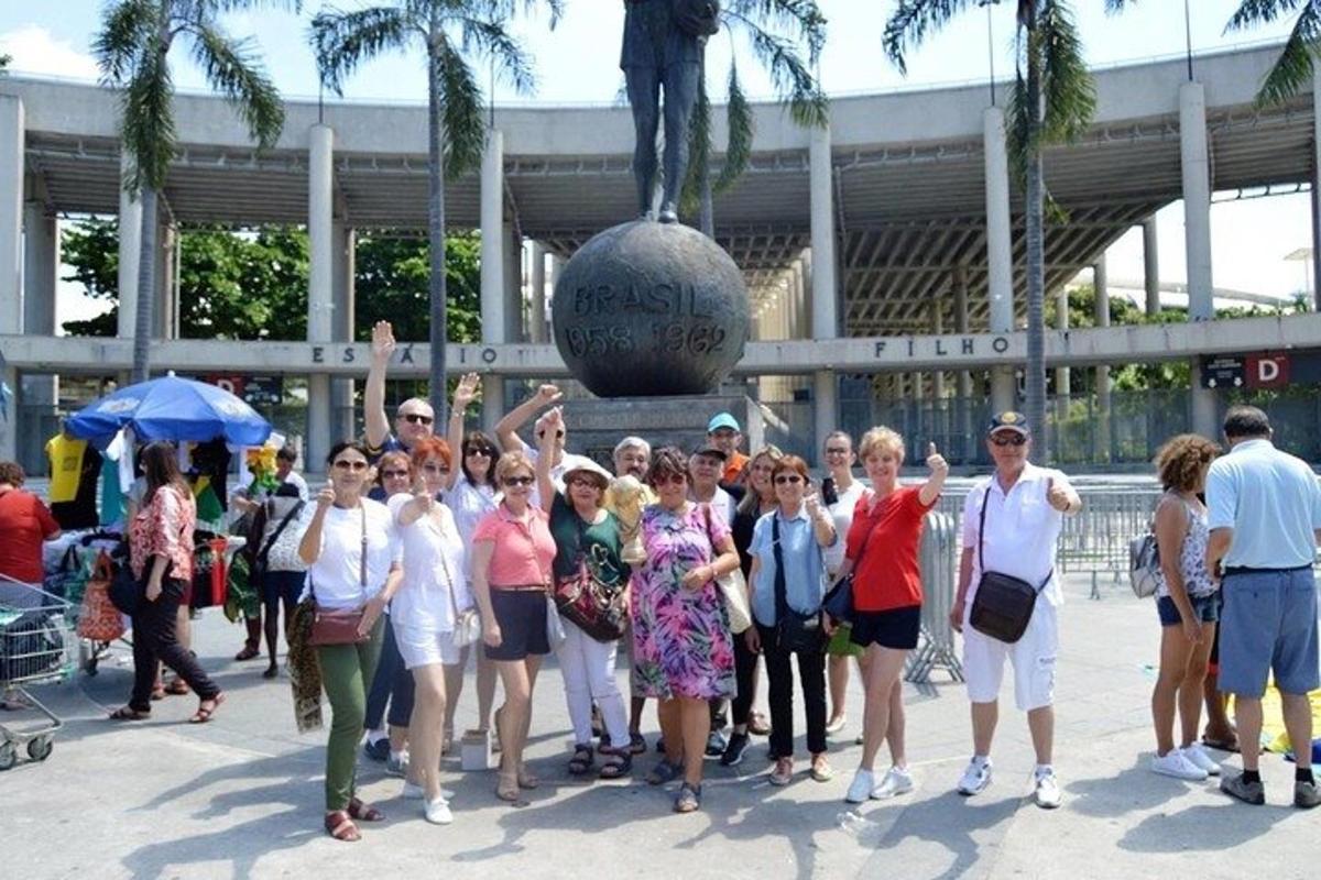 a group of people standing in front of a statue