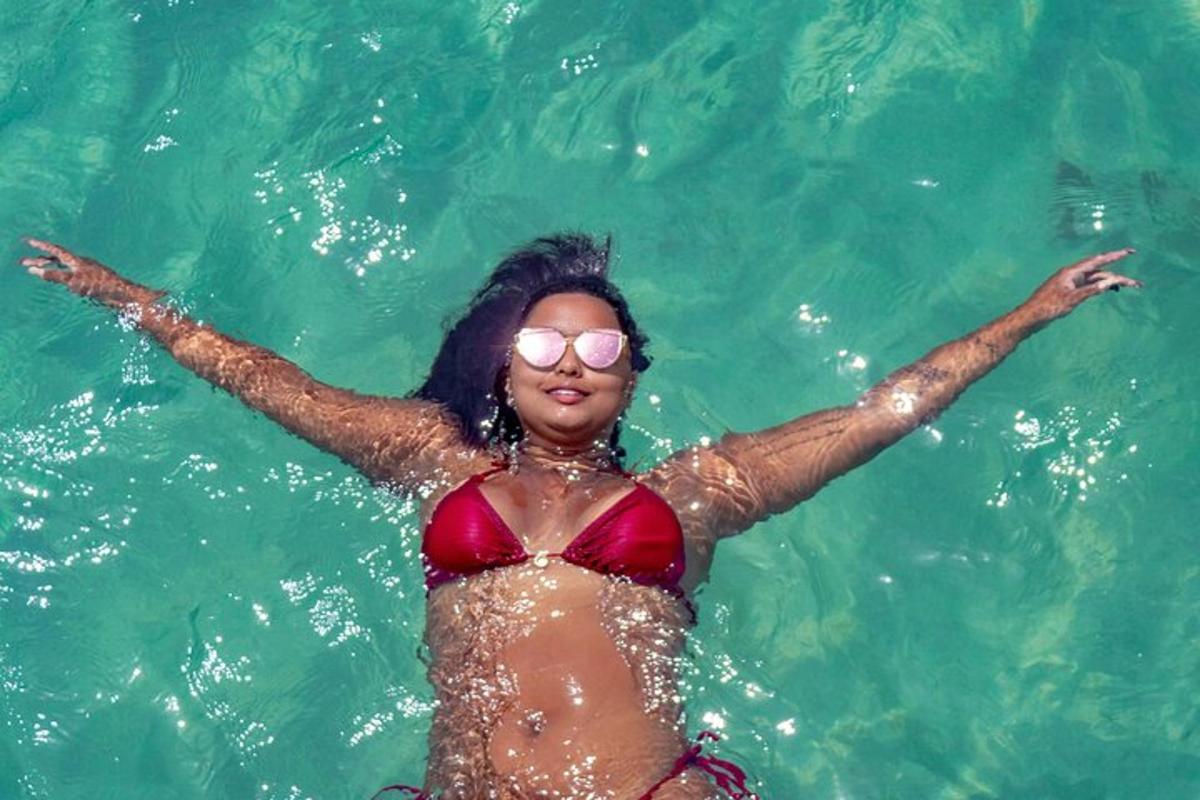 a woman in a red bikini in the water