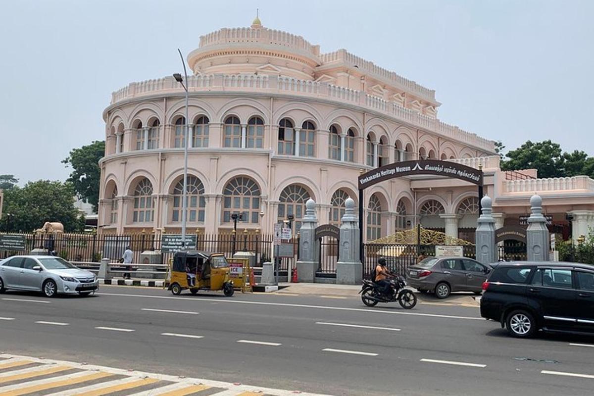 a large building with cars parked in front of it