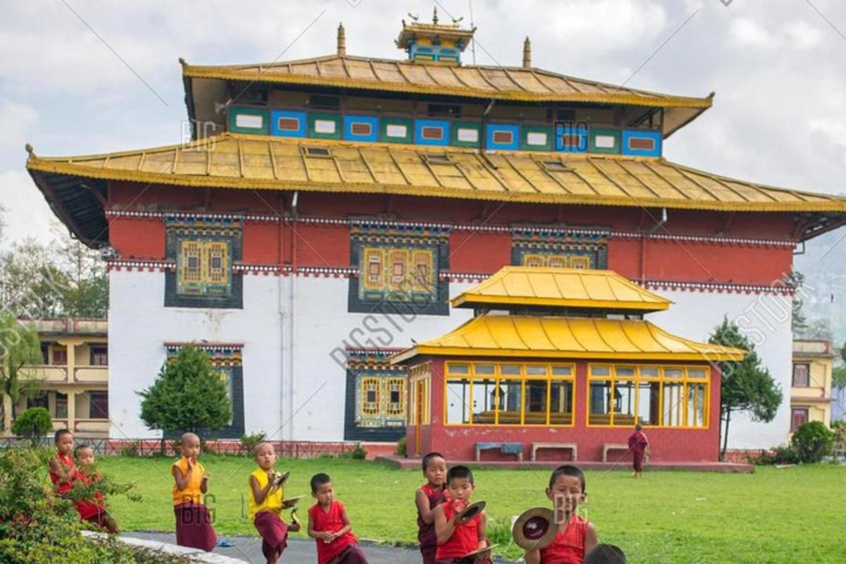 a group of children standing in front of a building