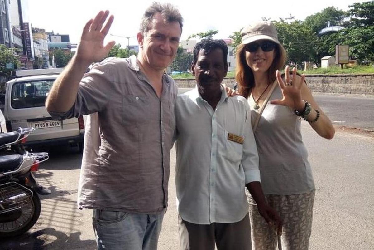 two men and a woman posing for a picture
