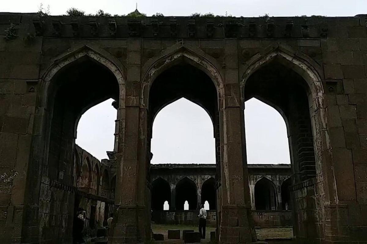 an old building with three arches in it