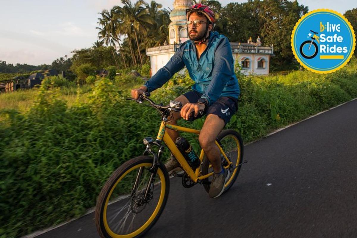 a man riding a bike down a road