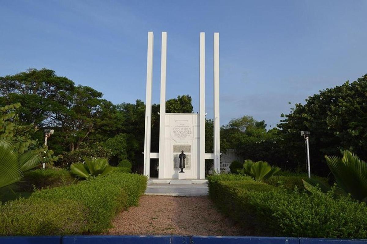 a monument in a park with a person in front
