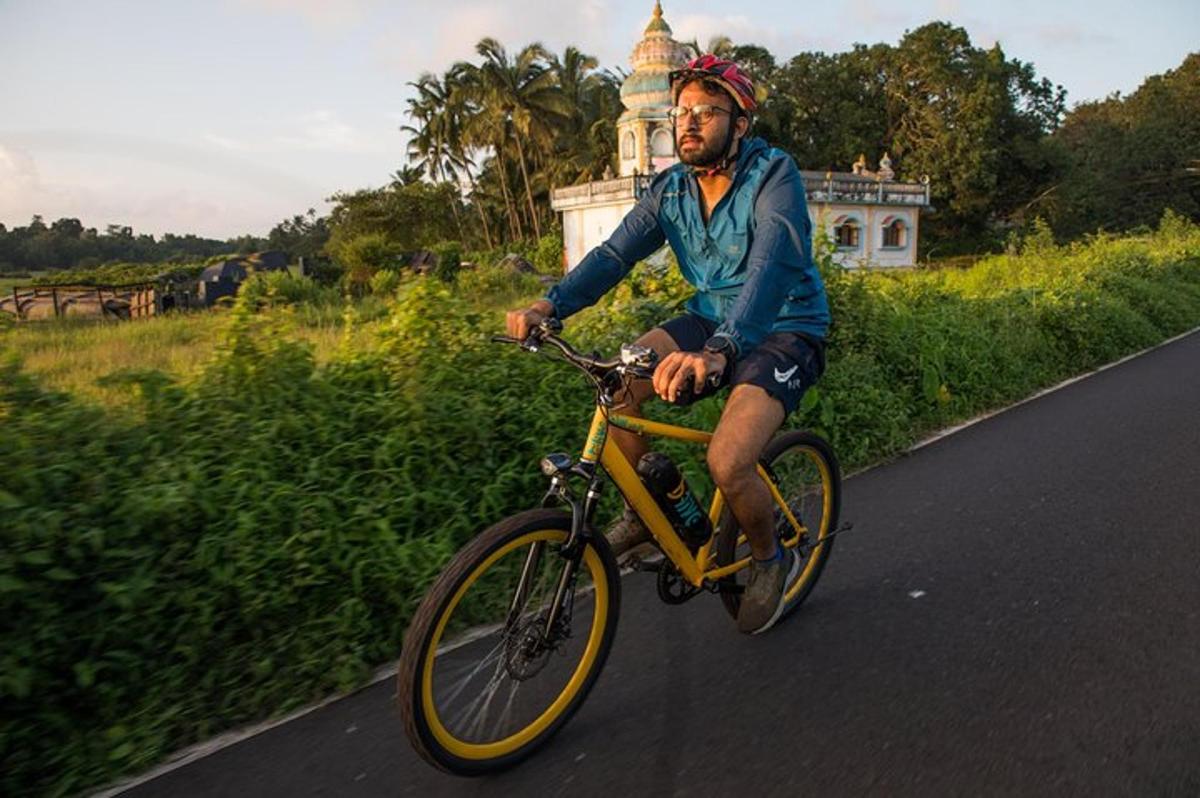 a man riding a bike down a road