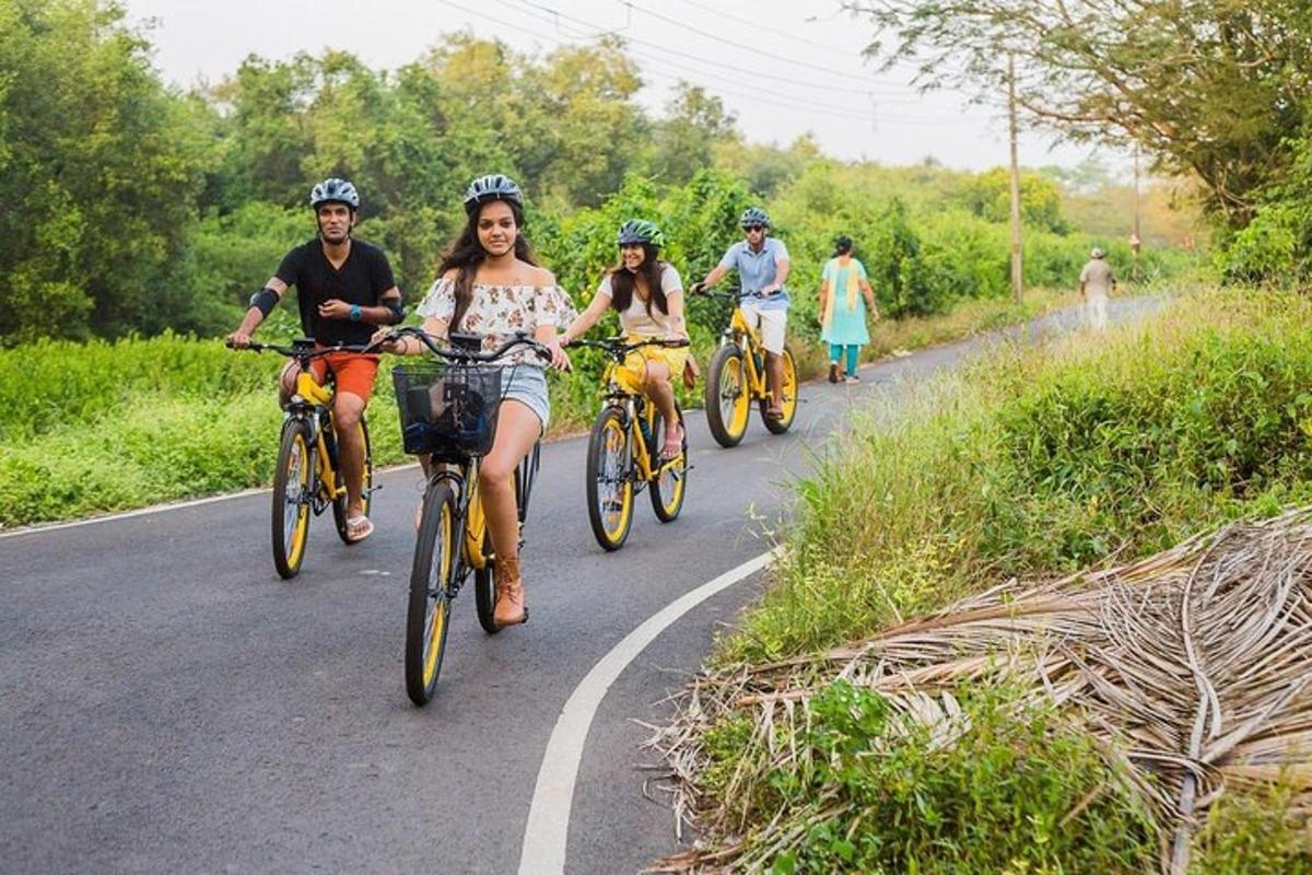 a group of people riding bikes down a road