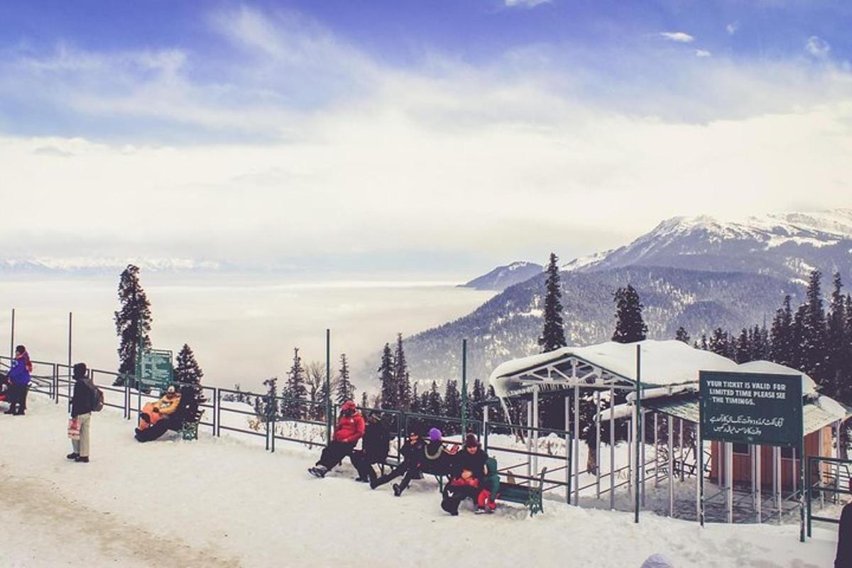 a group of people in the snow at a ski slope