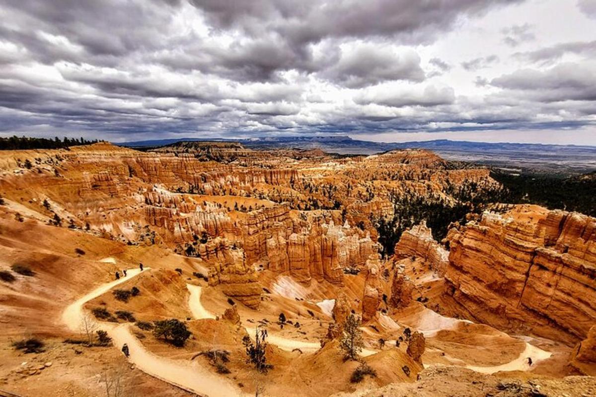 an aerial view of a canyon with a cloudy sky