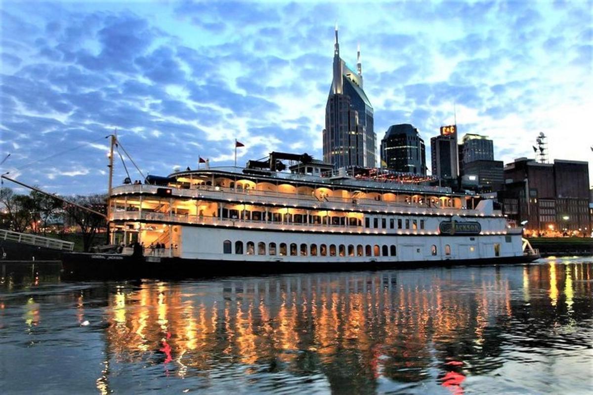 a cruise ship in the water with a city in the background