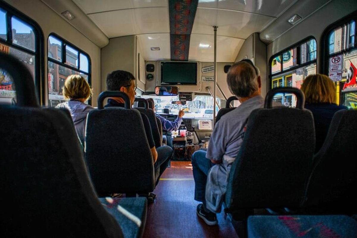 a group of people sitting on a bus