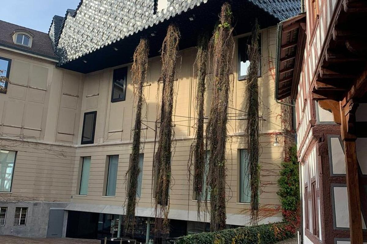 a building with vines growing on the side of it
