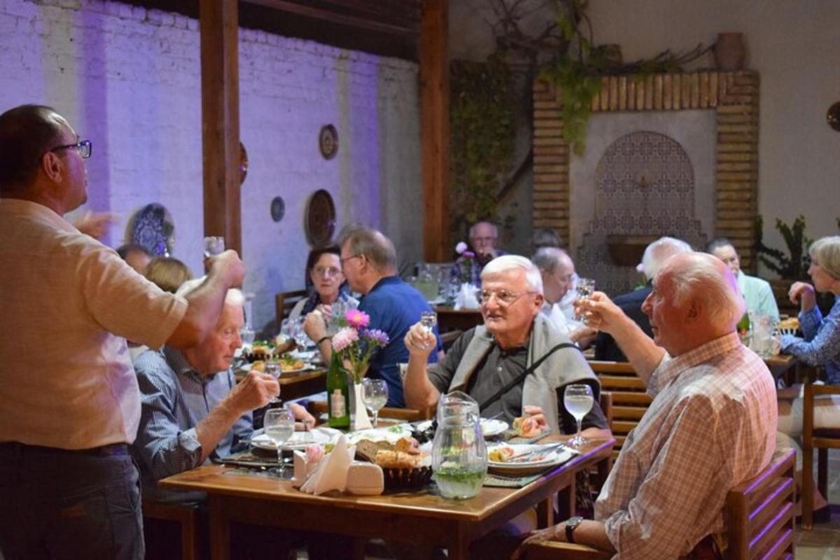 a group of people sitting at a table eating