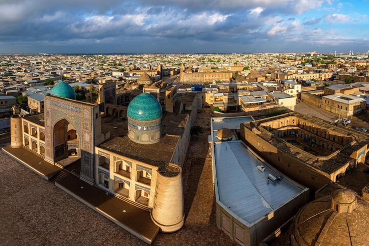an aerial view of a city with a mosque