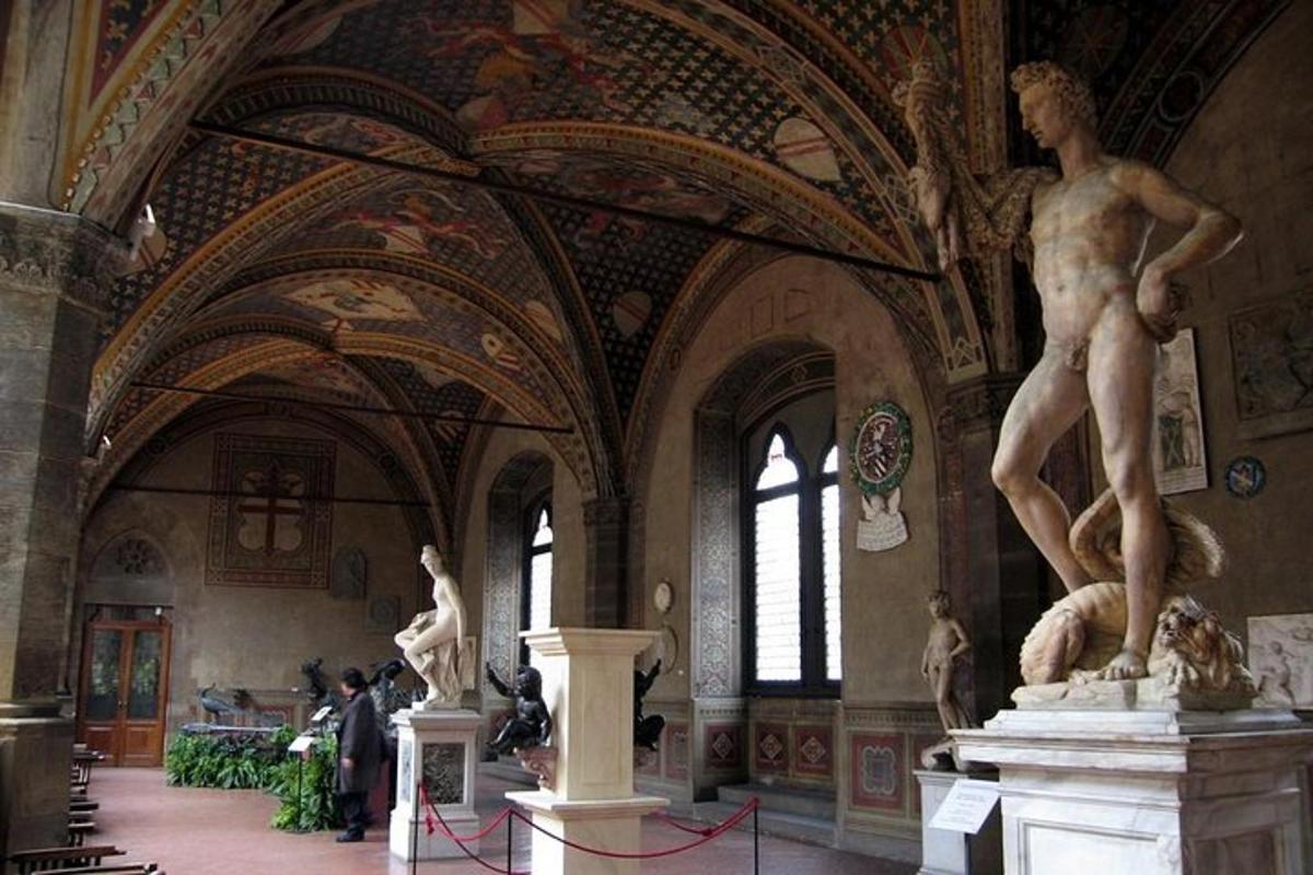 a large room with statues in a building