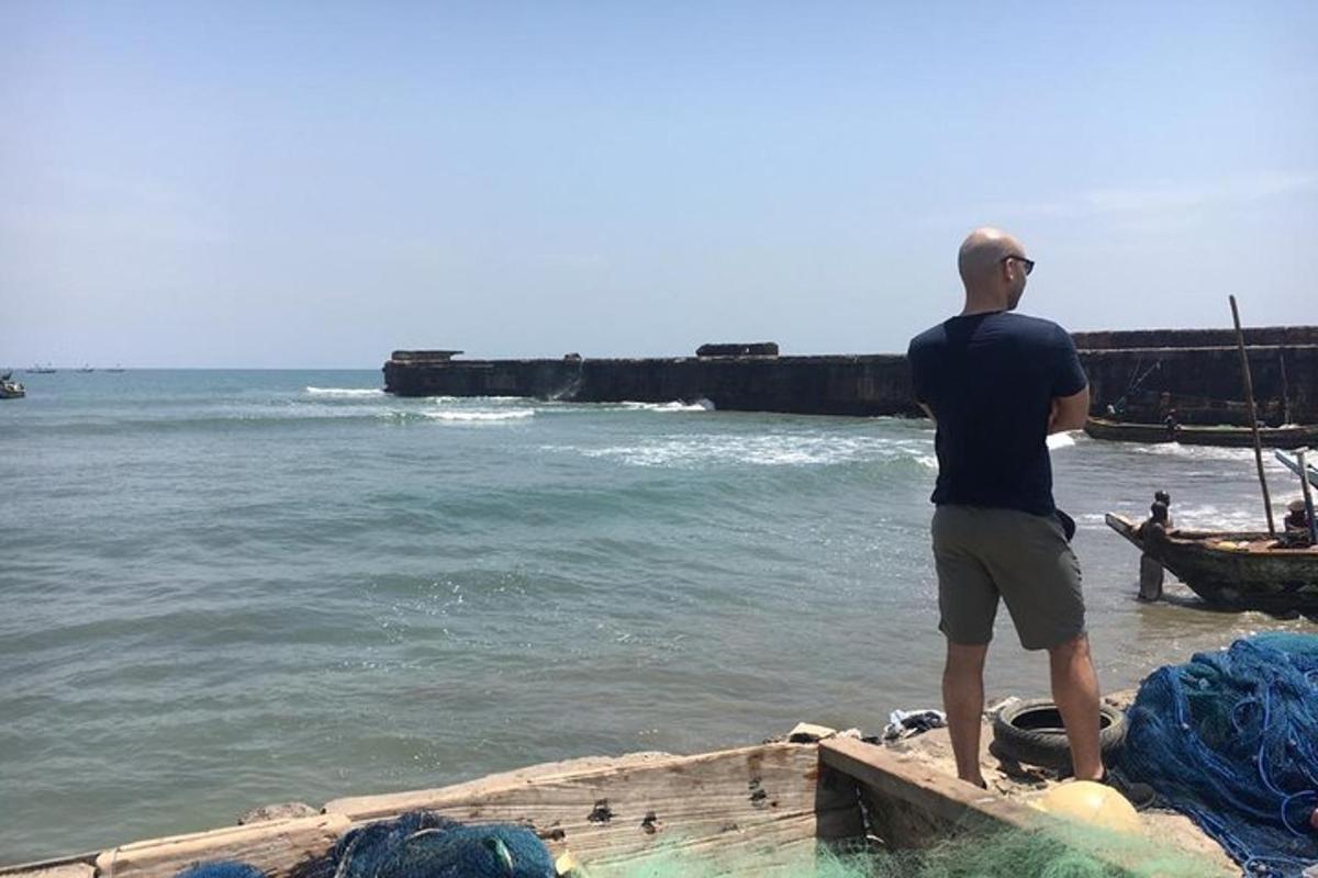 a man standing on a boat in the ocean