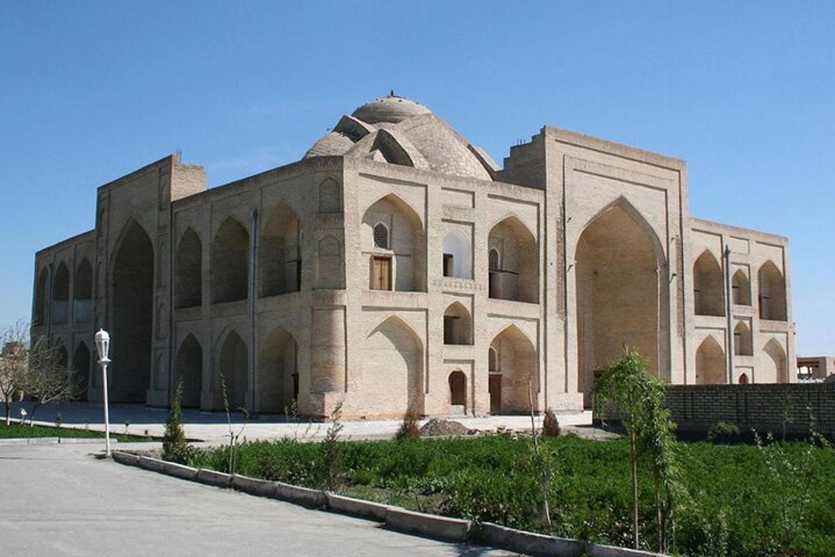 a large brick building with a dome on top