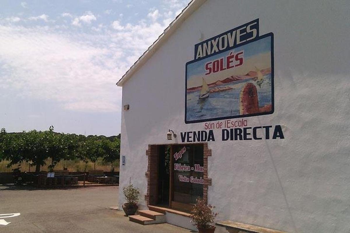 a white building with a sign on the side of it