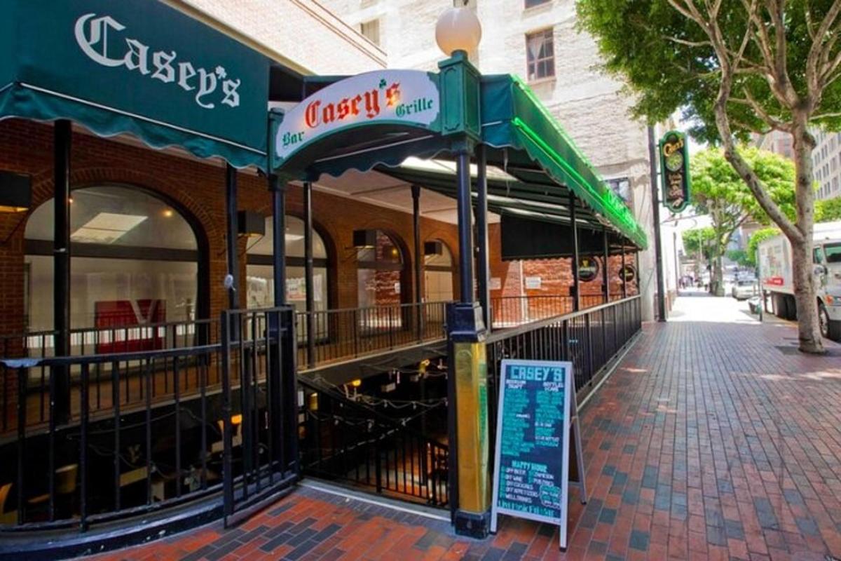 a restaurant on a street with a sign in front of it