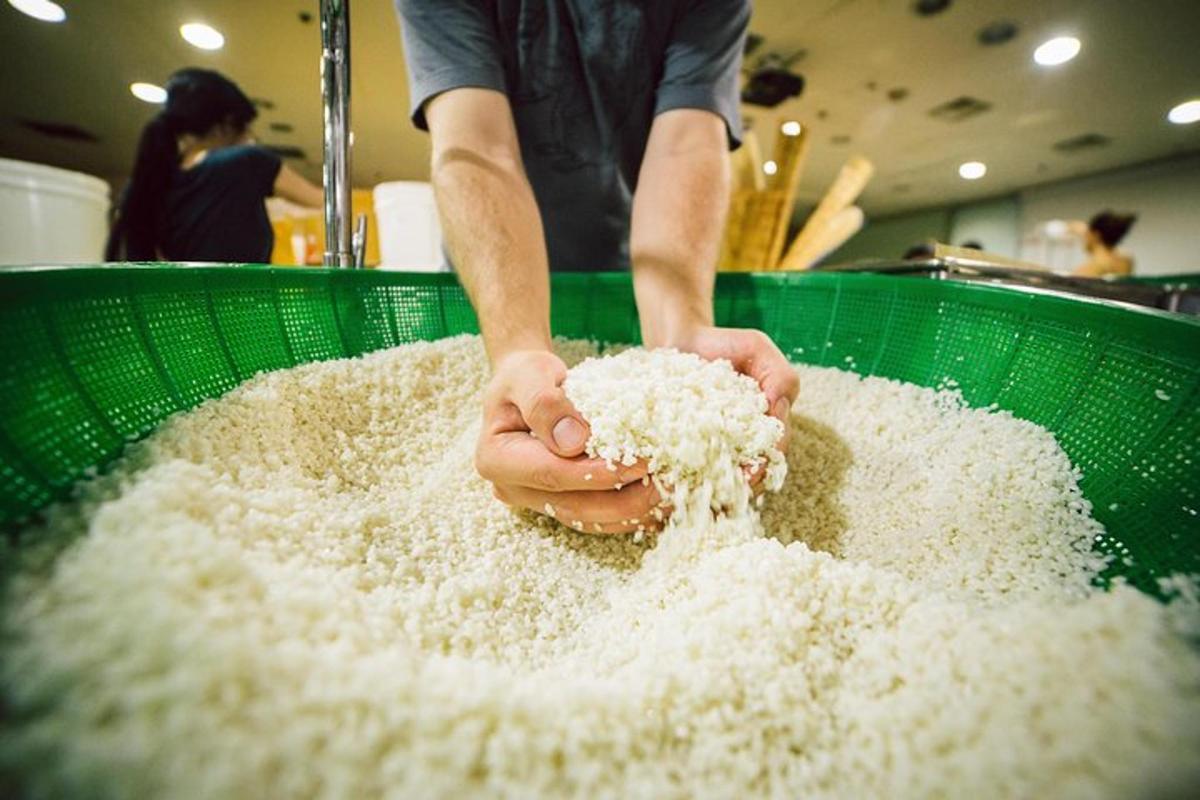 a person is mixing white rice in a bowl