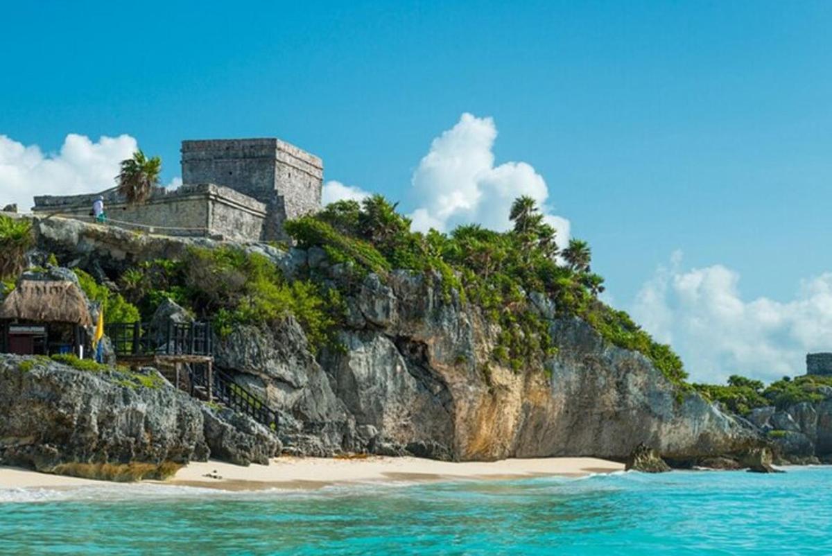 an island in the ocean with a building on it