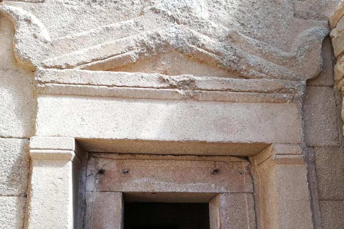 a stone building with a doorway in a building