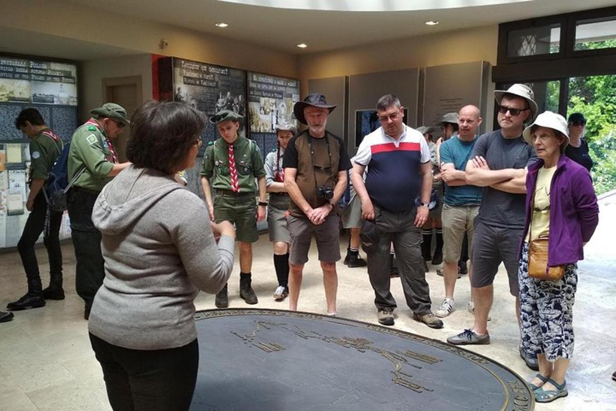 a group of people standing around a circle in a room