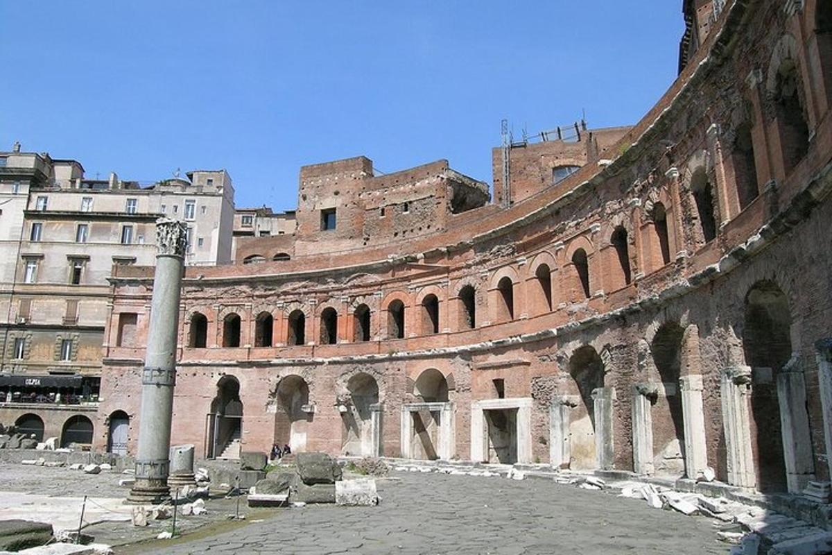a large brick building with a pole in a courtyard