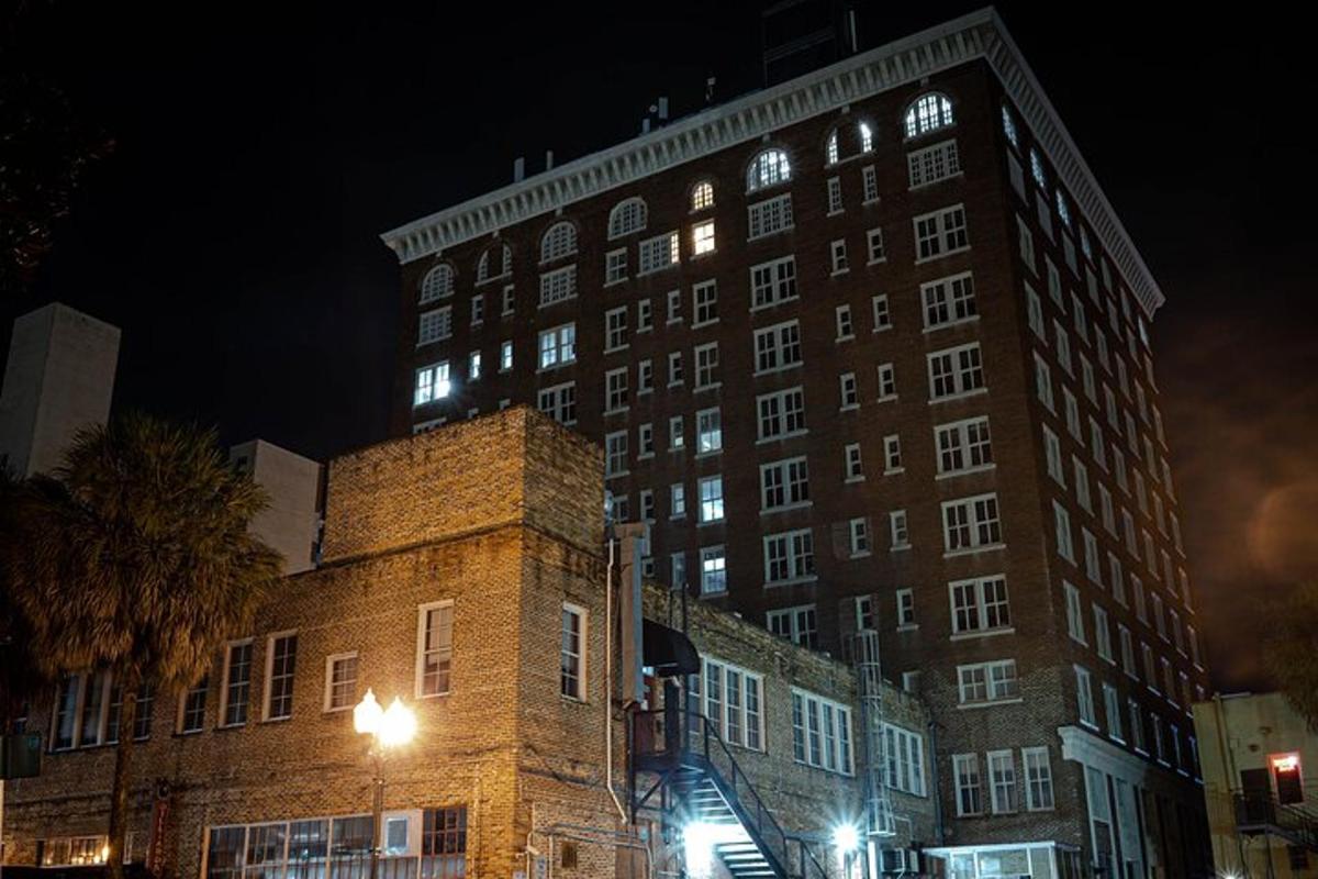 a large brick building with lights on it at night