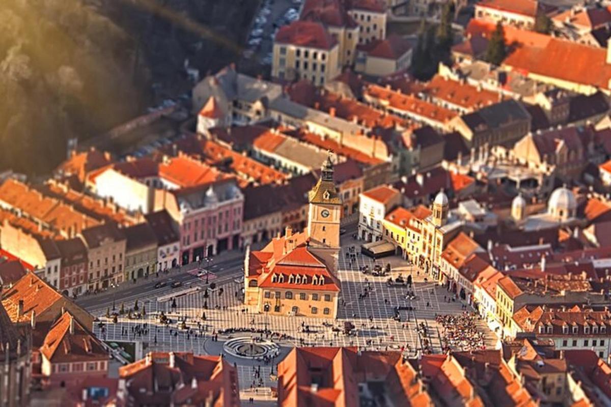 an aerial view of a city with orange roofs