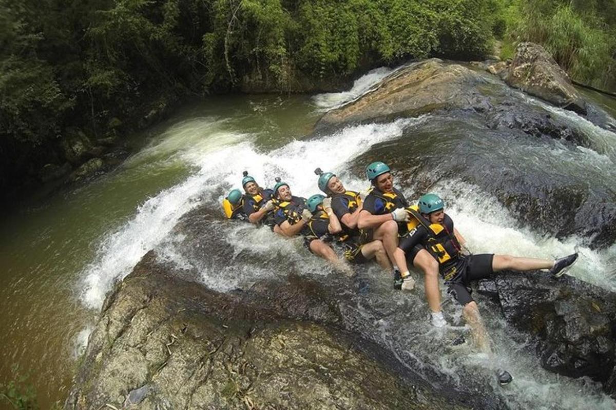 a group of people on a raft in a river