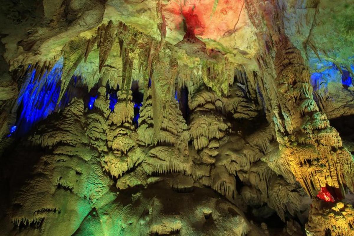 a view of a cave with blue lights in it