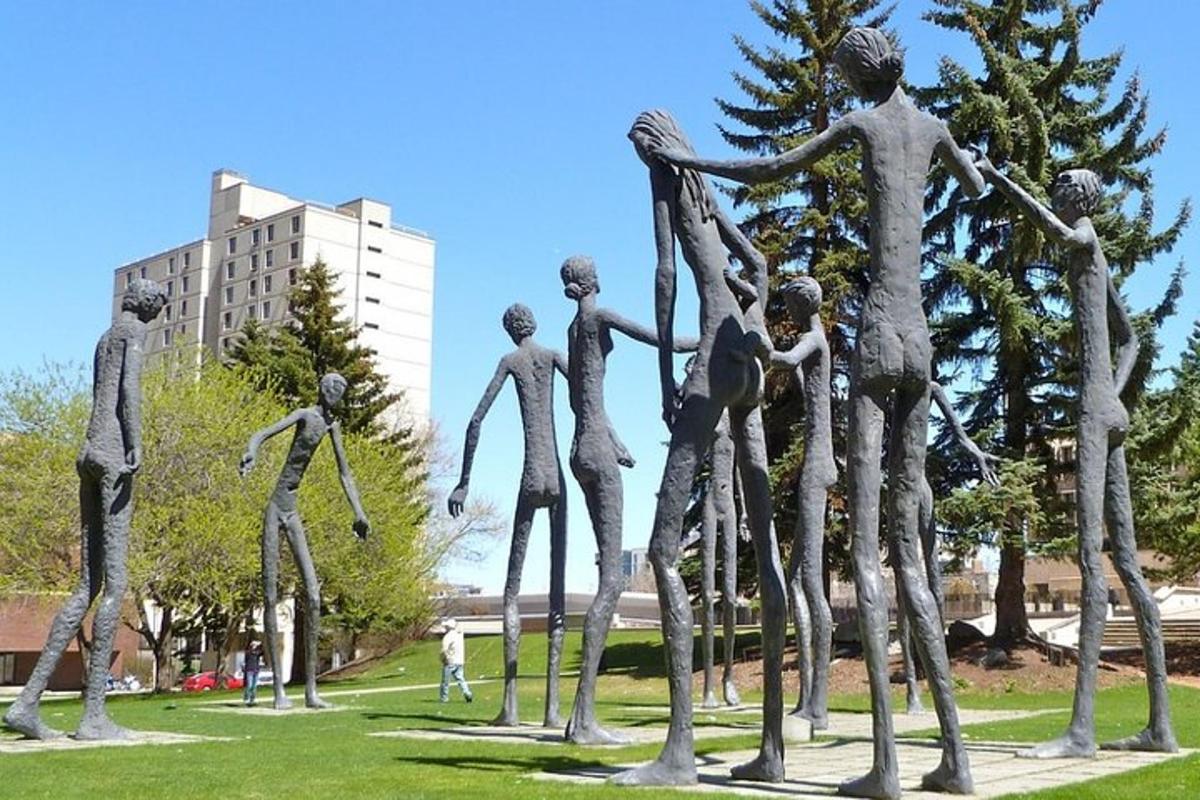 a statue of people standing in a park