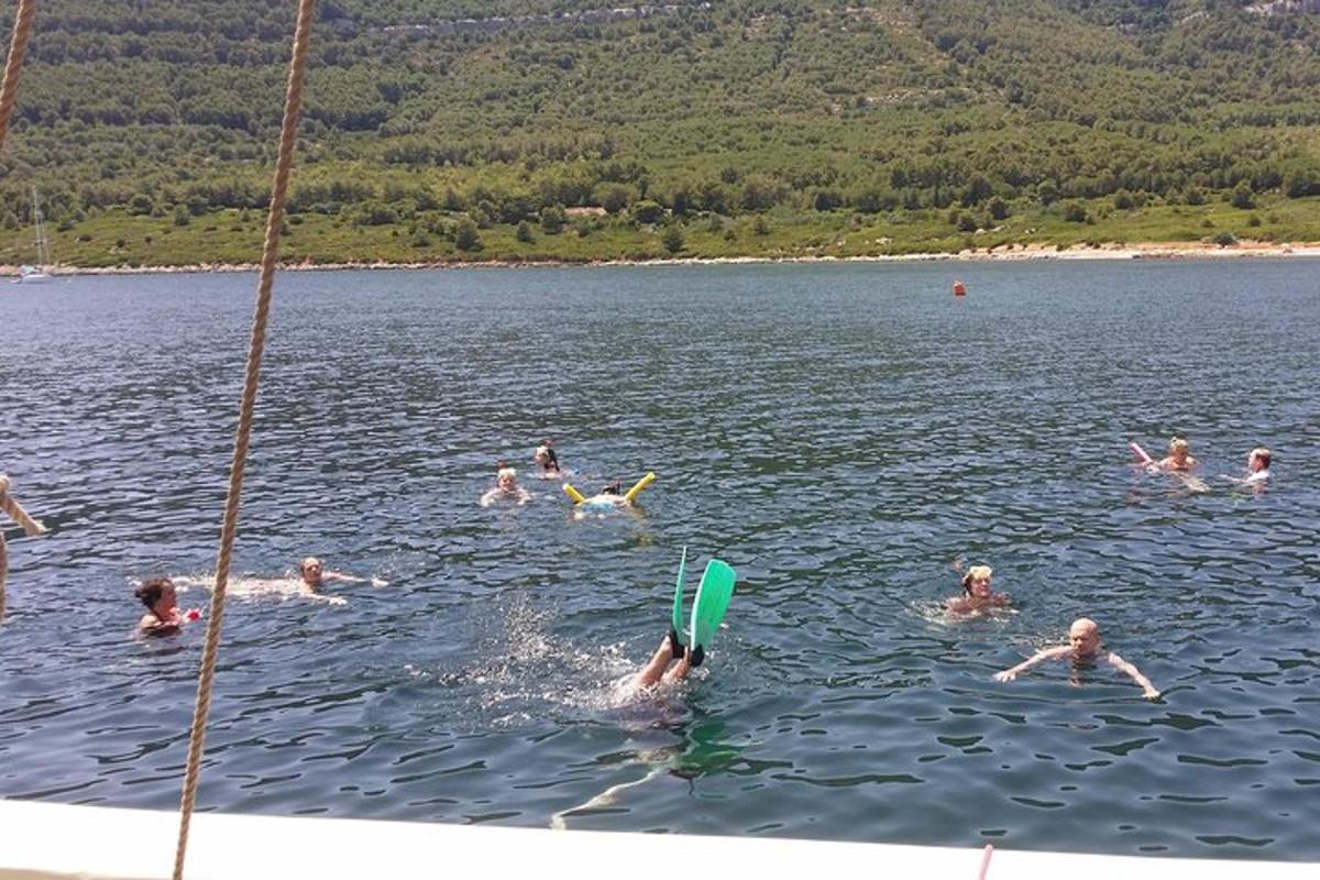 a group of people swimming in a lake