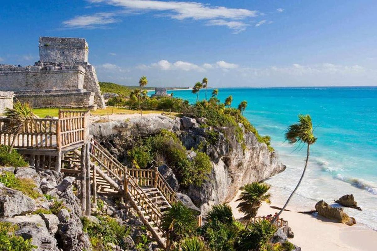 a view of a beach with a building and the ocean