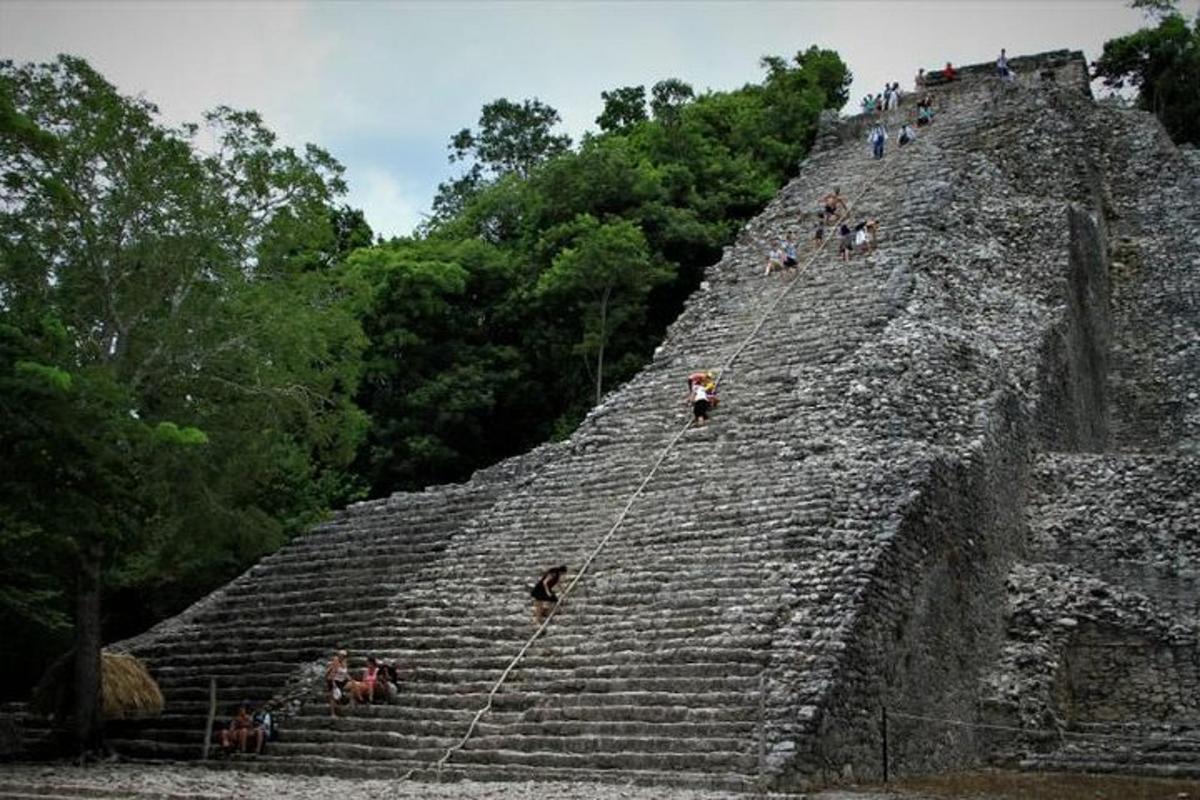 a group of people on the top of a pyramid