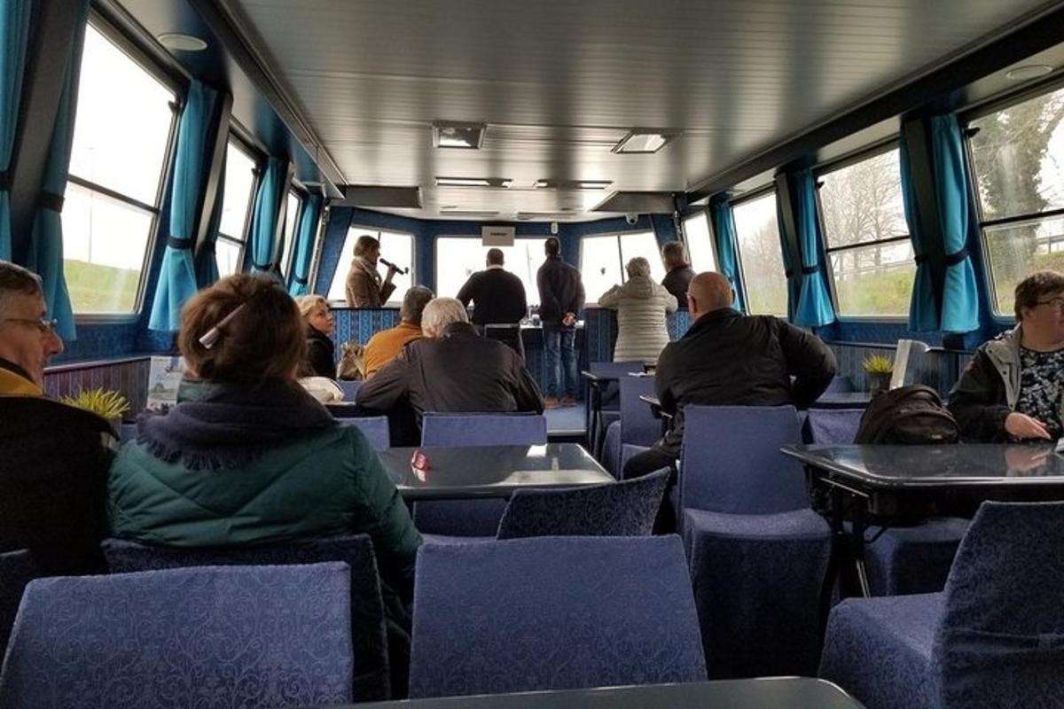 a group of people sitting inside of a train