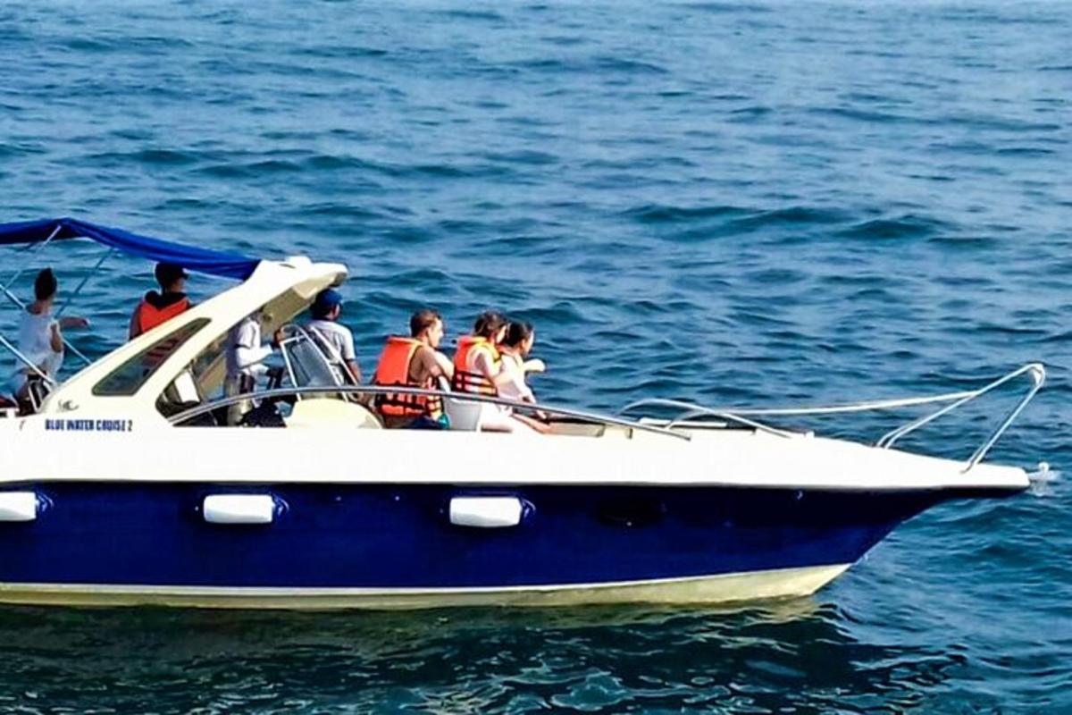 a group of people on a boat in the water