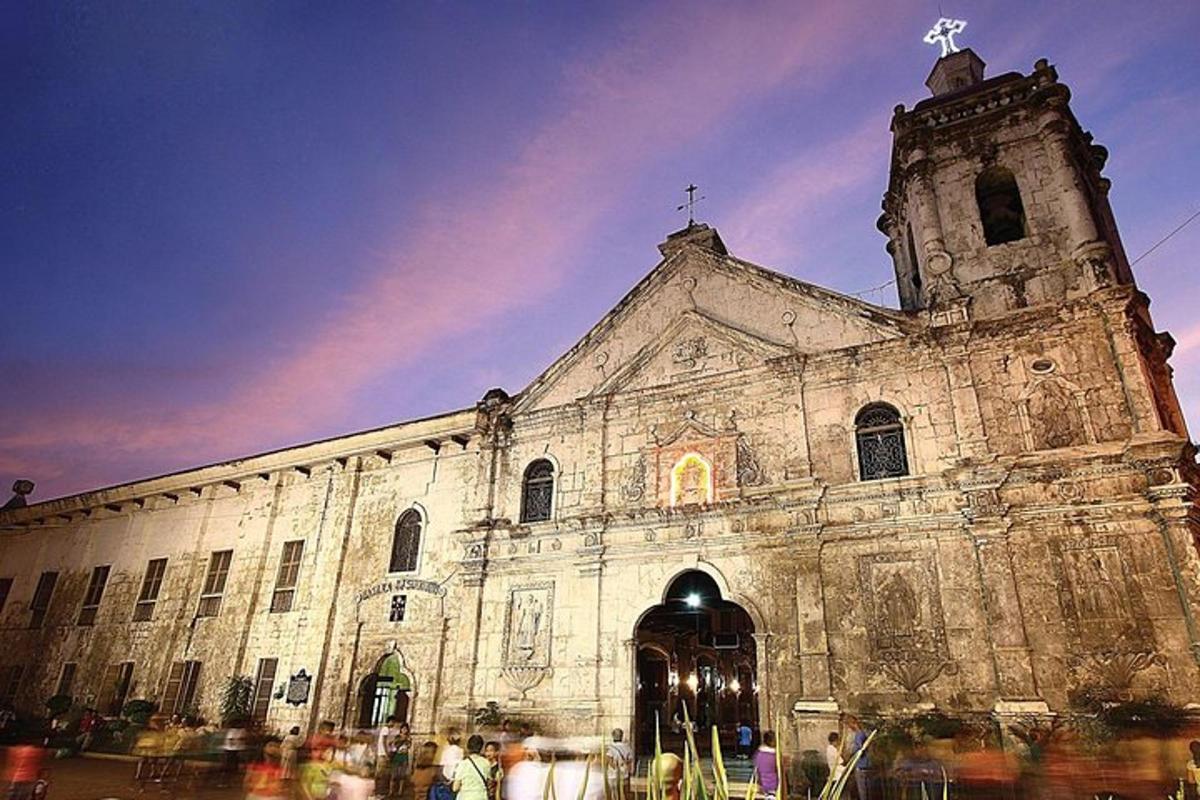an old church with a cross on top of it