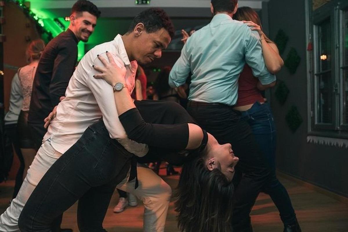 a group of people dancing on a dance floor