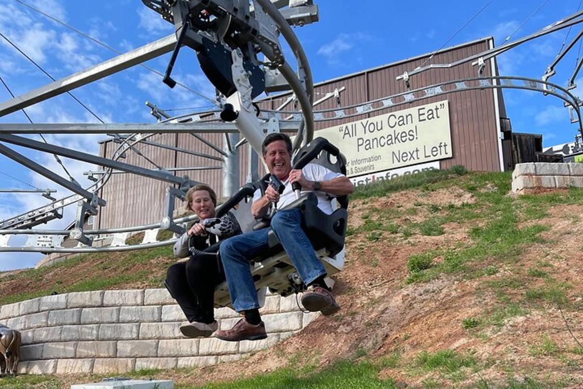 a man and a woman sitting on a ski lift
