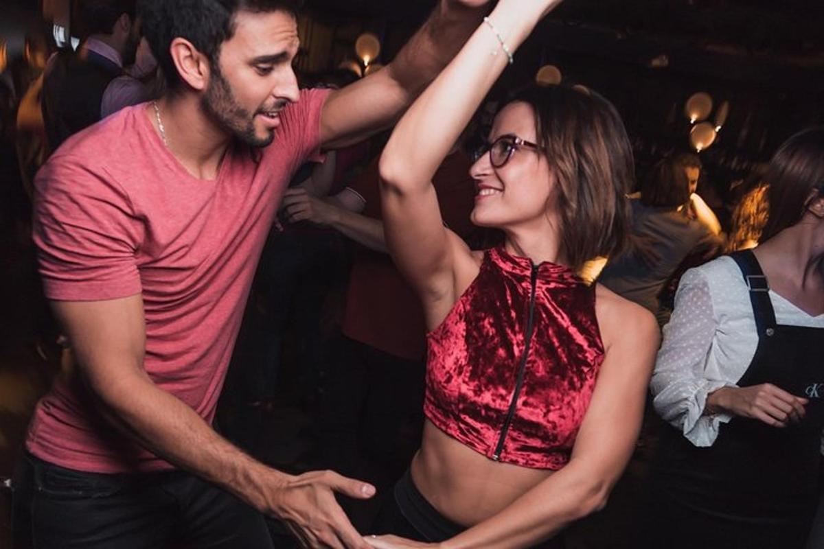a man and a woman dancing at a party