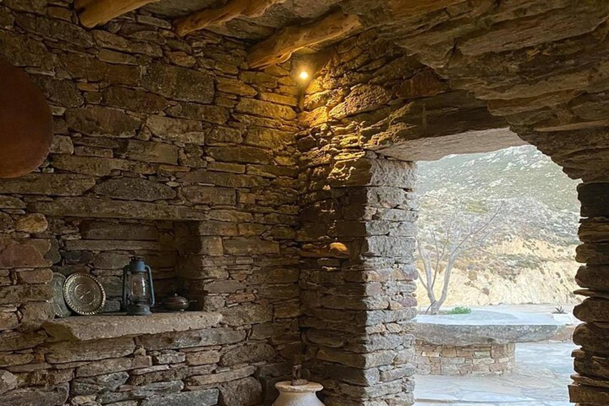 a stone building with a stone wall with a window