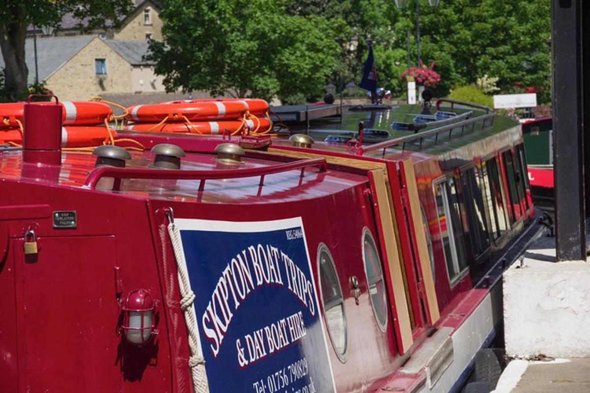 a red train with a sign on the side of it