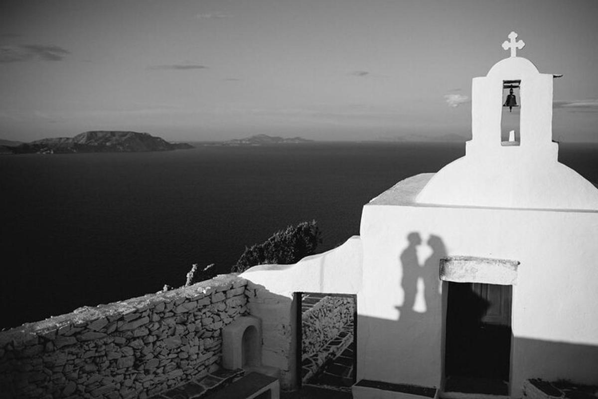 a shadow of a man and woman on the side of a building