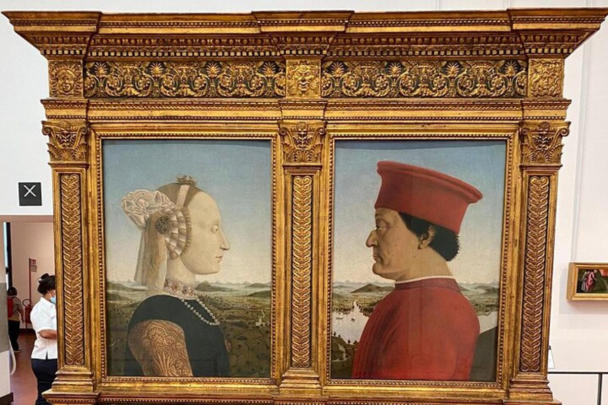 un dipinto incorniciato di un uomo e una donna