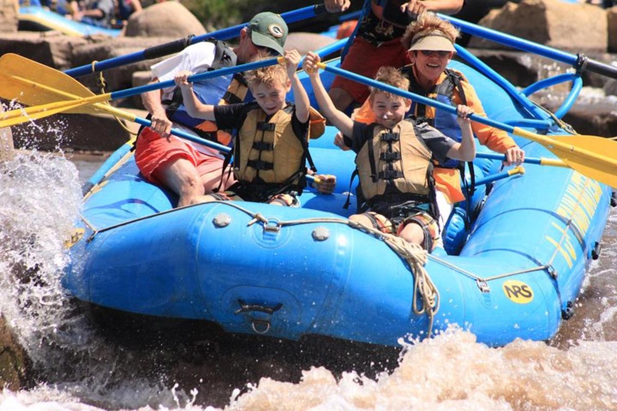 a group of people on a raft in the water